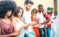 Multicultural friends group on addicted moment using mobile smart phones - Gen-z young people hypnotized by social media networks Royalty Free Stock Photo