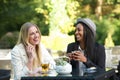 Multicultural Friends Laughing and Drinking Tea