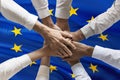 Multicultural hands union concept over european flag