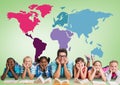 Multicultural Kids reading in front of colorful world map with teacher Royalty Free Stock Photo