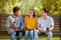 Multicultural Millennials Talking Sitting On Bench Outside After College Classes Royalty Free Stock Photo