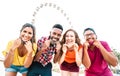 Multicultural people taking happy photo with open face masks after lockdown reopening - New normal lifestyle concept Royalty Free Stock Photo