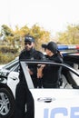 Multicultural police officers with paper cups