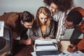 multicultural retro styled journalists looking at text Royalty Free Stock Photo