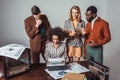 multicultural retro styled journalists at newsroom Royalty Free Stock Photo