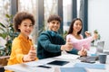 Multicultural students giving thumbs up at study session Royalty Free Stock Photo