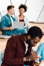 Multicultural students in glasses using laptop Royalty Free Stock Photo
