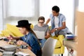 multicultural teenagers studying with laptop and computer motherboard Royalty Free Stock Photo