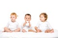 multicultural toddlers with smartphone sitting in row