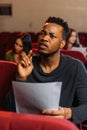 Young actor and actresses reading scripts