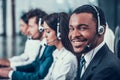 Multicultural young happy employees in call center