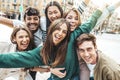 Multicultural young people smiling at camera outside Royalty Free Stock Photo