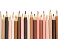 Multiculture skin tone color pencils background isolated on white Royalty Free Stock Photo