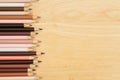 Multiculture skin tone color pencils background on wood desk Royalty Free Stock Photo