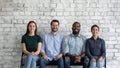 Multiethnic applicants sit on chairs wait turn for job interview