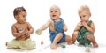 Multiethnic babies playing with blocks Royalty Free Stock Photo