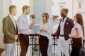 Multiethnic Business people having coffee break at the balcony of office building Royalty Free Stock Photo