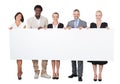 Multiethnic business people holding large billboard