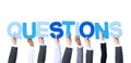Multiethnic Business People Holding Word Questions Royalty Free Stock Photo