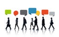 Multiethnic Business People Walking in a Row with Speech Bubble Royalty Free Stock Photo