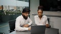 Multiethnic business team diverse people brainstorm in office two arabian men and african woman using laptop computer Royalty Free Stock Photo