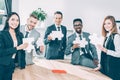 multiethnic businesspeople holding puzzle pieces together Royalty Free Stock Photo