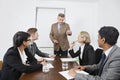 Multiethnic businesspeople at meeting in conference room Royalty Free Stock Photo