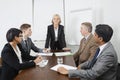 Multiethnic businesspeople at meeting in conference room Royalty Free Stock Photo