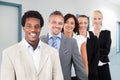 Multiethnic businesspeople smiling at office