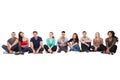 Multiethnic college students sitting in a row Royalty Free Stock Photo
