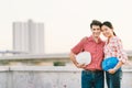 Multiethnic couple of construction engineers at construction site or factory at sunset, industrial occupation concept Royalty Free Stock Photo