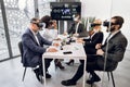 Multiethnic creative business team using virtual reality headsets at the meeting in modern office. Group of developers Royalty Free Stock Photo