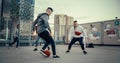 Multiethnic Diverse Friends Playing Soccer Outside on Rooftop Urban City Location. Skilful Young Man