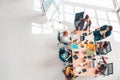 Multiethnic diverse group of business coworkers in team meeting discussion, top view modern office with copy space Royalty Free Stock Photo
