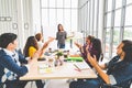 Multiethnic diverse group of creative team or business coworker clap hands in project presentation meeting leading by Asian woman Royalty Free Stock Photo