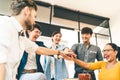 Multiethnic diverse group of happy colleagues join hands together. Creative team, casual business coworker, or college students Royalty Free Stock Photo