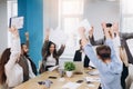 Multiethnic diverse happy team celebrate project success throw paper up together. Corporate community, college graduation, startup Royalty Free Stock Photo