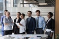 Multiethnic employees smile for camera pose in modern office boardroom Royalty Free Stock Photo