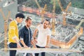 Multiethnic engineer, architect team work together on building development project planning, under construction site background Royalty Free Stock Photo