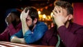 Multiethnic football fans making facepalm, disappointed with game loss, bar Royalty Free Stock Photo