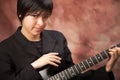 Multiethnic Girl Poses with Electric Guitar Royalty Free Stock Photo