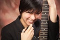 Multiethnic Girl Poses with Electric Guitar Royalty Free Stock Photo