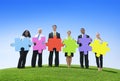 Multiethnic Group of Business People with Jigsaw Puzzle Royalty Free Stock Photo