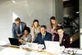 Multiethnic group of business people working together and preparing new project on a meeting in office Royalty Free Stock Photo