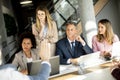 Multiethnic group of business people working together and preparing new project on a meeting in office Royalty Free Stock Photo