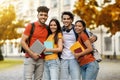 Multiethnic group of cheerful young students standing together outdoors Royalty Free Stock Photo
