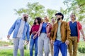 Multiethnic group of friends walking in the street outdoors laughing and having fun. diverse people celebrating life together Royalty Free Stock Photo