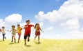 group of school children running on the grass Royalty Free Stock Photo