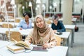 Group of multiethnic students in a library Royalty Free Stock Photo