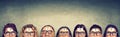 Multiethnic group of thinking people in glasses with question mark looking up Royalty Free Stock Photo